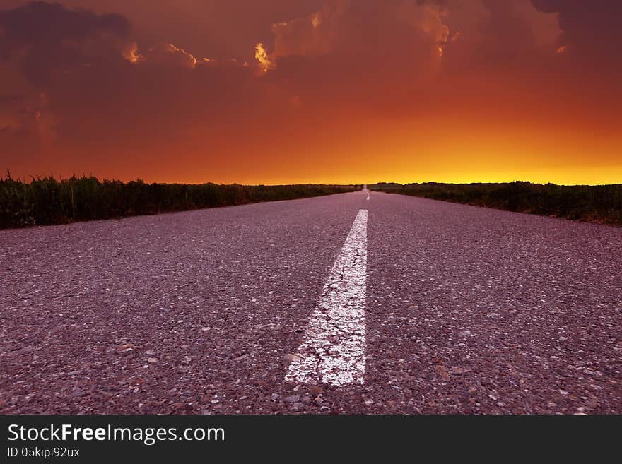 Endless driving on country road at sunset. Endless driving on country road at sunset.