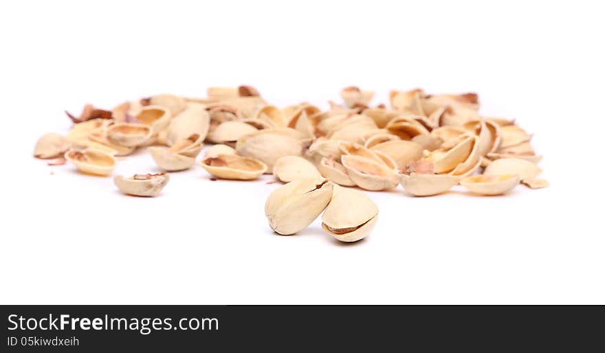 Peel pistachios on a white background