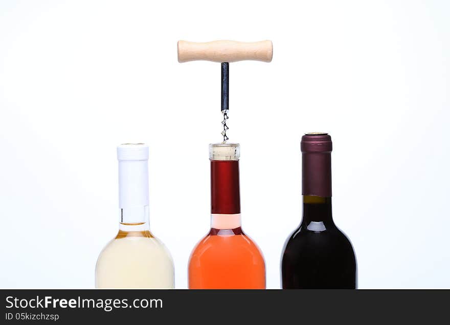 A Set Of Three Kinds Of Wine And Corkscrew