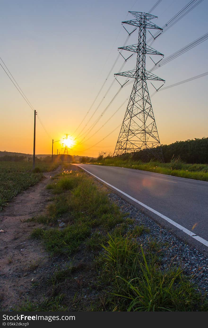 The sun sets with a road and Power lines. The sun sets with a road and Power lines