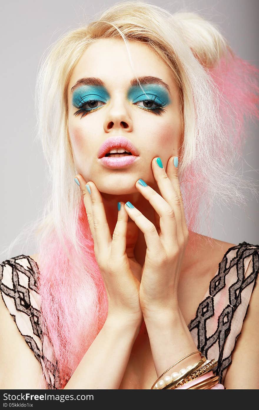 Vitality. Eccentric Blond with Theatrical Cyan Makeup. Dyed Pink Hair