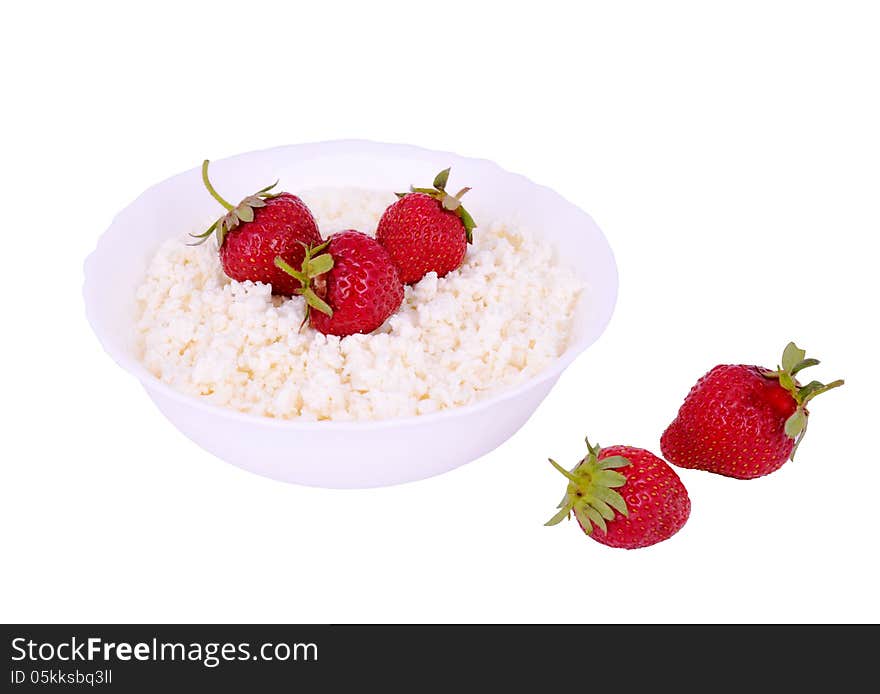 The plate with cottage cheese and strawberries white