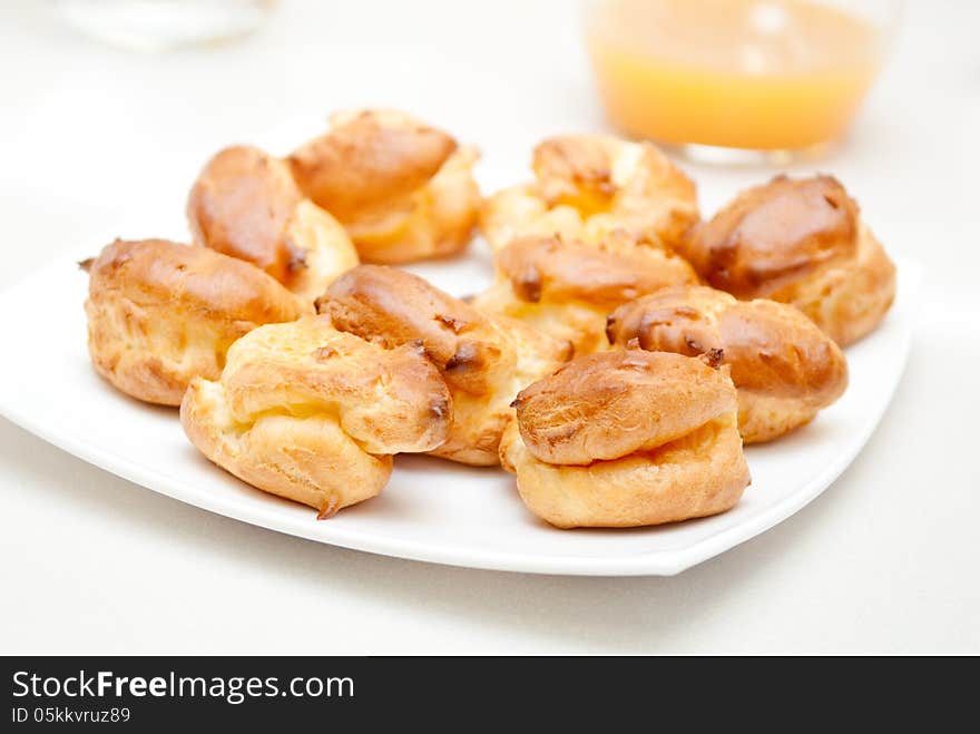 Delisious Profiteroles On The White Plate