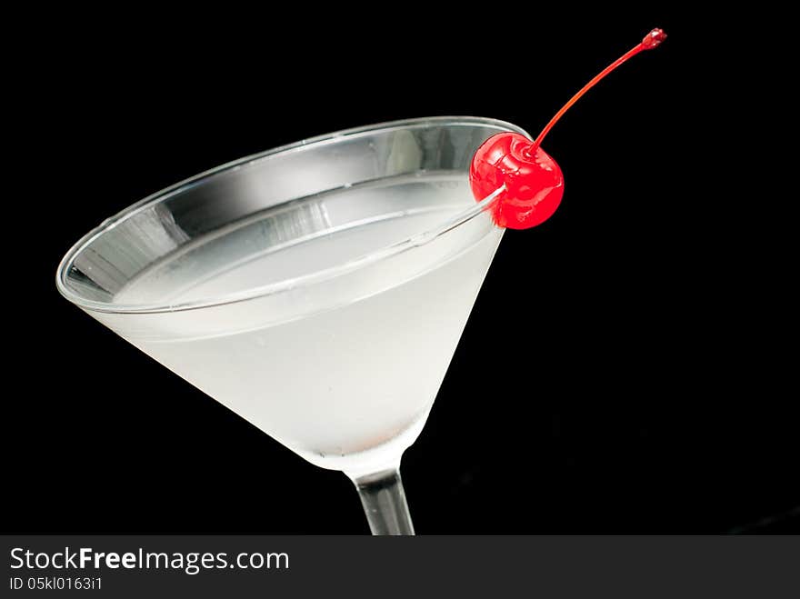 Cocktail In Martini Glass With Red Cherry Closeup