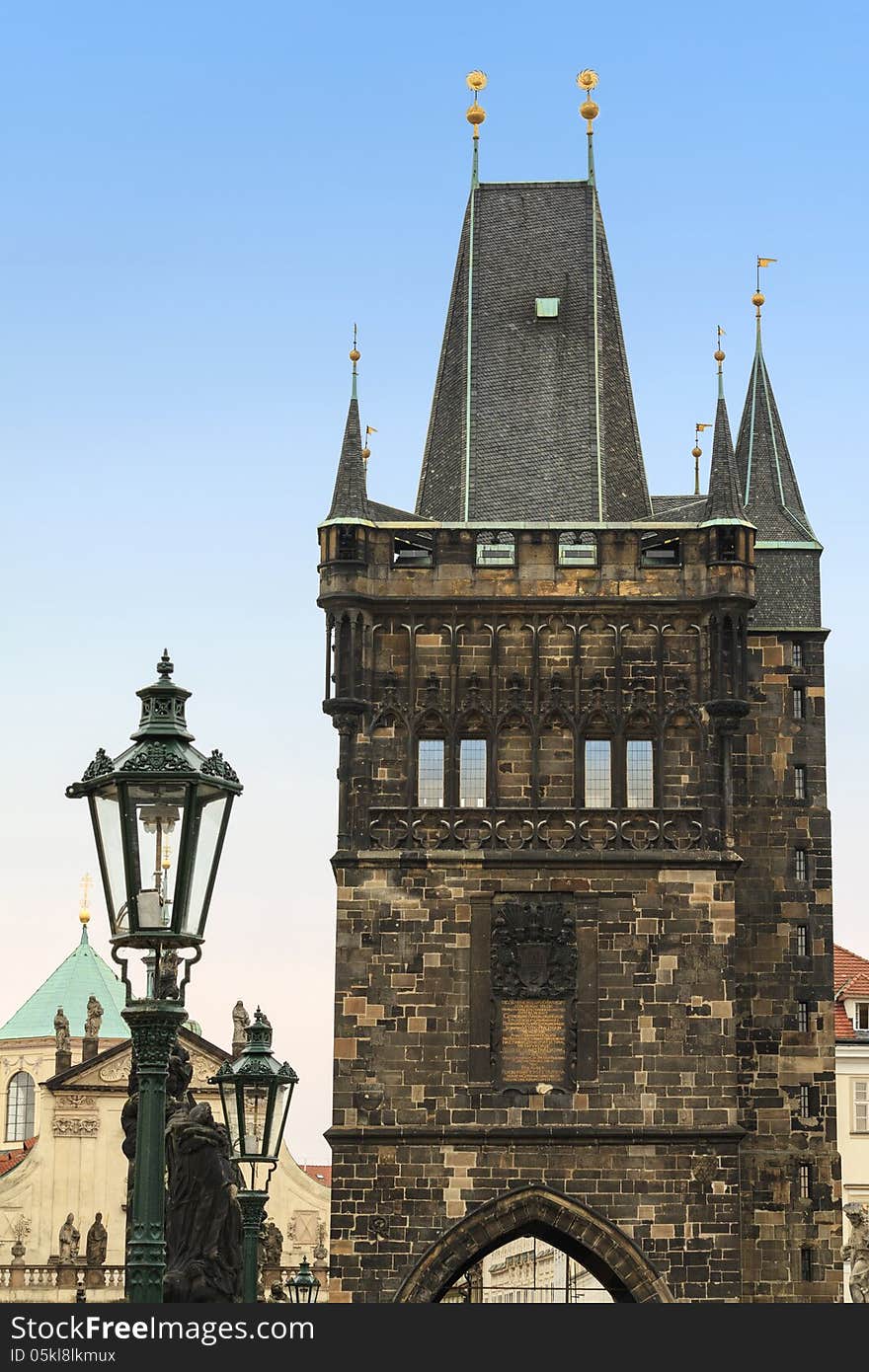 Old Town Bridge Tower in Prague. This blackened, aged gate was completed in 1380 and forms part of the old fortification system of Prague, built to protect the Old Town against northern invaders.