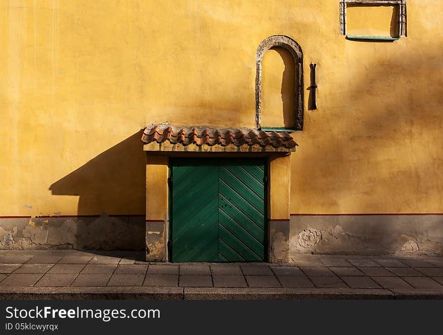 Green door mustard wall