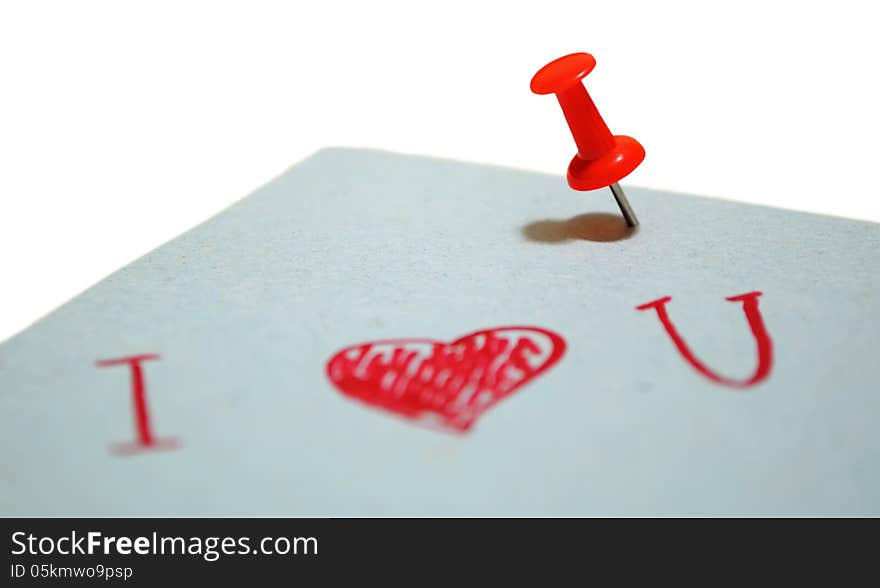 Blue piece of paper with a note, pinned a red pin on a white background. Blue piece of paper with a note, pinned a red pin on a white background