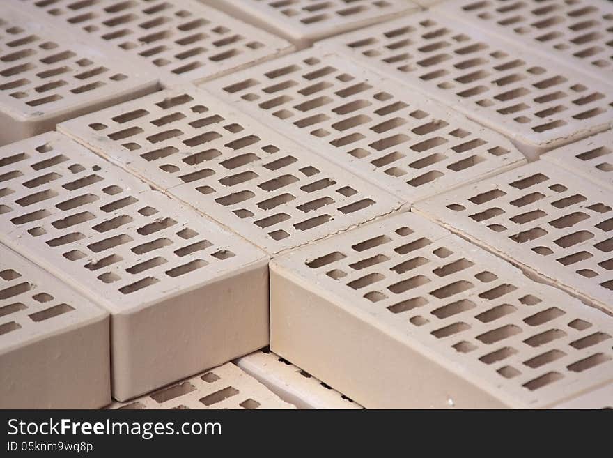 White bricks on a construction site. Storage of materials prior to construction. White bricks on a construction site. Storage of materials prior to construction.