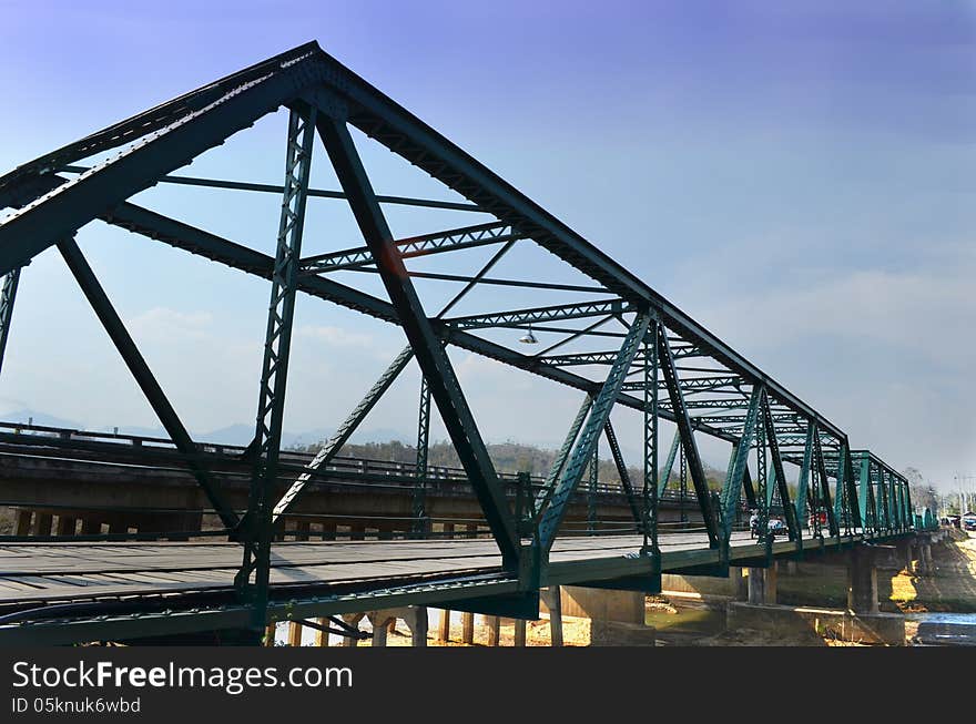 Historical Iron Bridge Cross River, Cloudy and Blue Sky, Maehong province, Thailand.