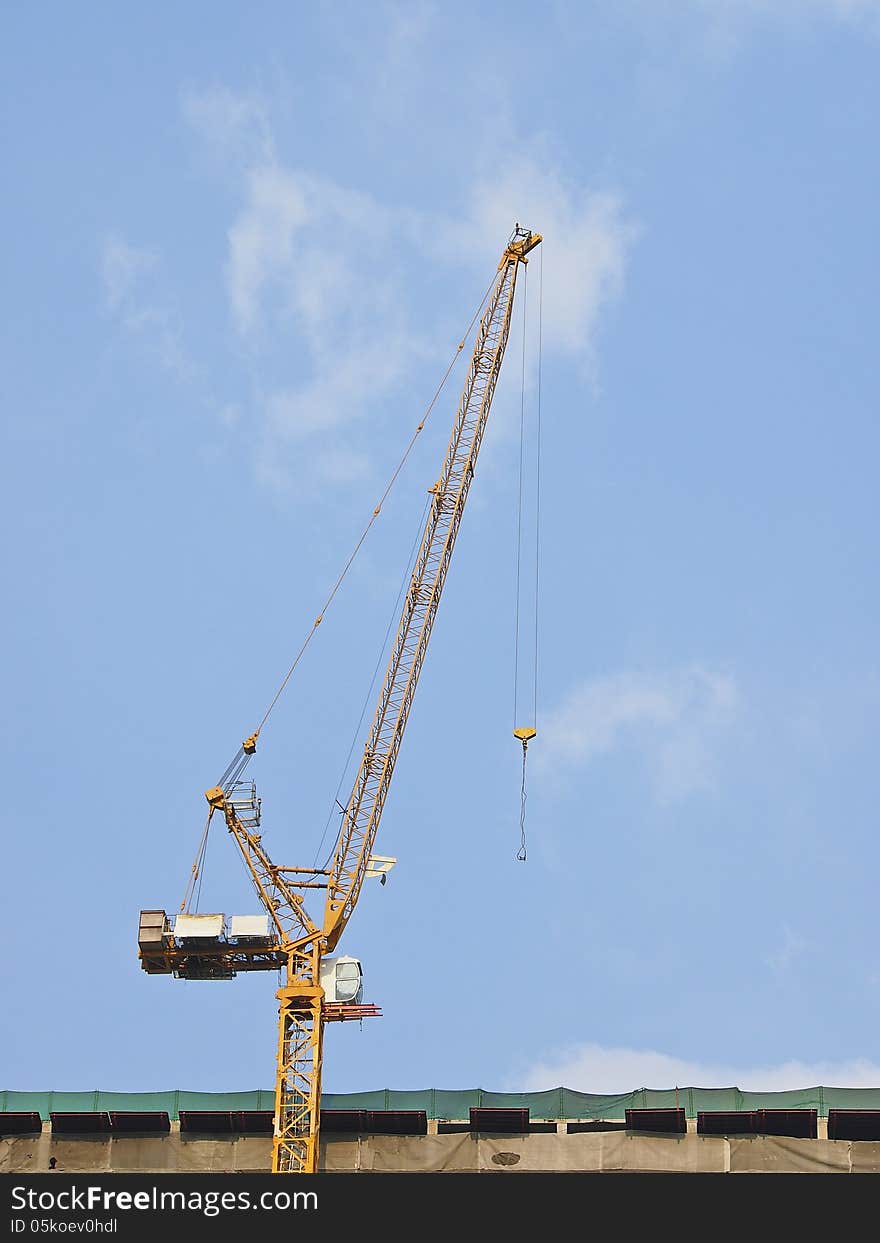 Crane on top of building in Construction site