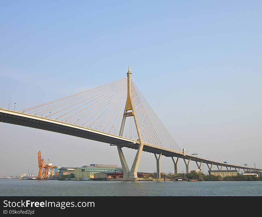 View of Bhumibol bridge across Chao Phraya river and Industrial area at Phra Pradaeng, Samut Prakan province, Thailand. View of Bhumibol bridge across Chao Phraya river and Industrial area at Phra Pradaeng, Samut Prakan province, Thailand