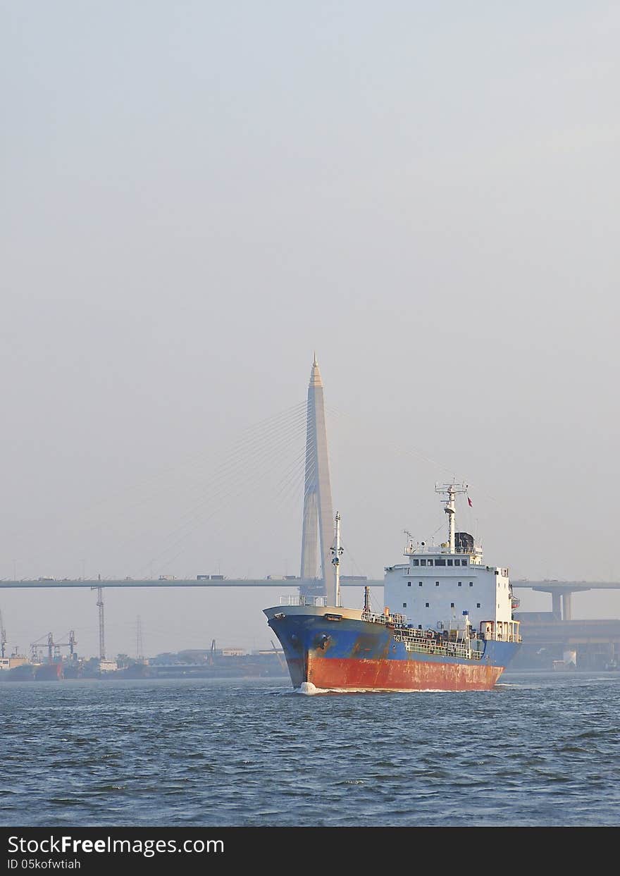 Ship in Chao Phraya River in background of Bhumibol bridge, Thailand. Ship in Chao Phraya River in background of Bhumibol bridge, Thailand