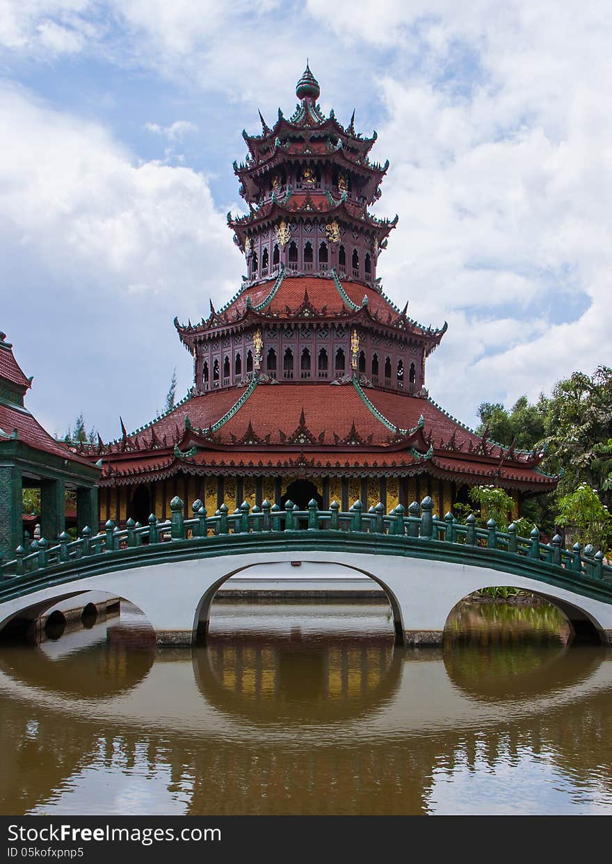 Chinese red pagoda with a bridge cross over a canal