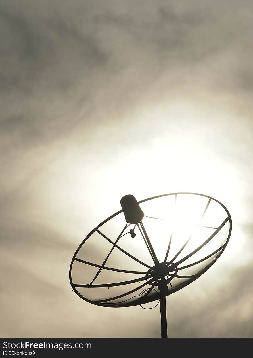 Silhouette image of satellite dish in cloudy day. Silhouette image of satellite dish in cloudy day