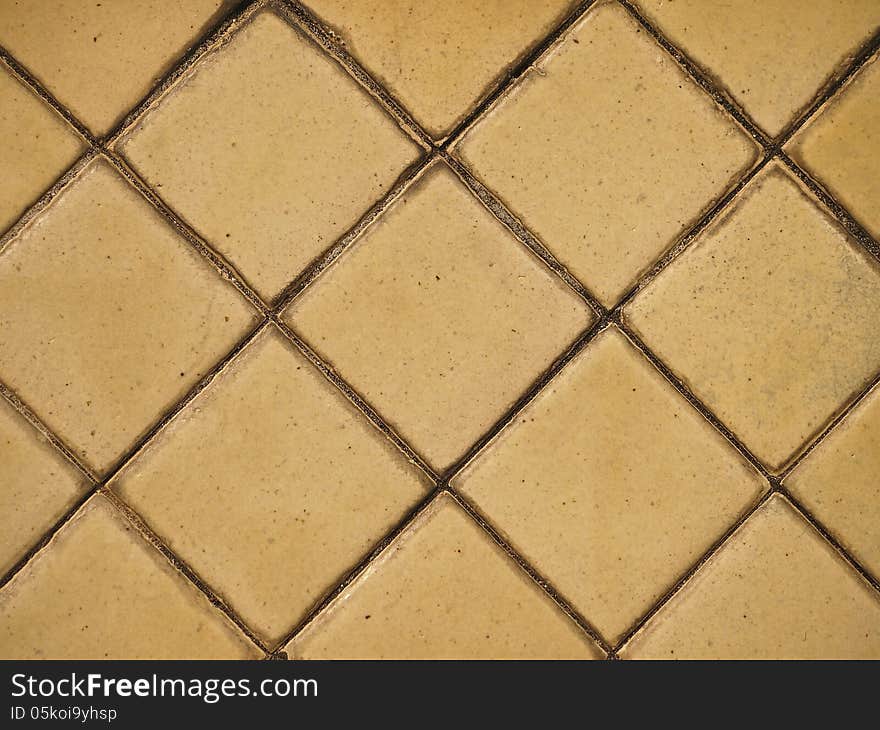 Part of surface of old pale yellow tile. Part of surface of old pale yellow tile