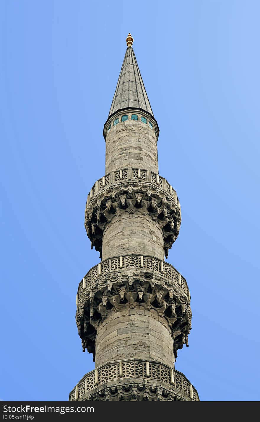 Minaret against clear blue sky, view from below. Minaret against clear blue sky, view from below