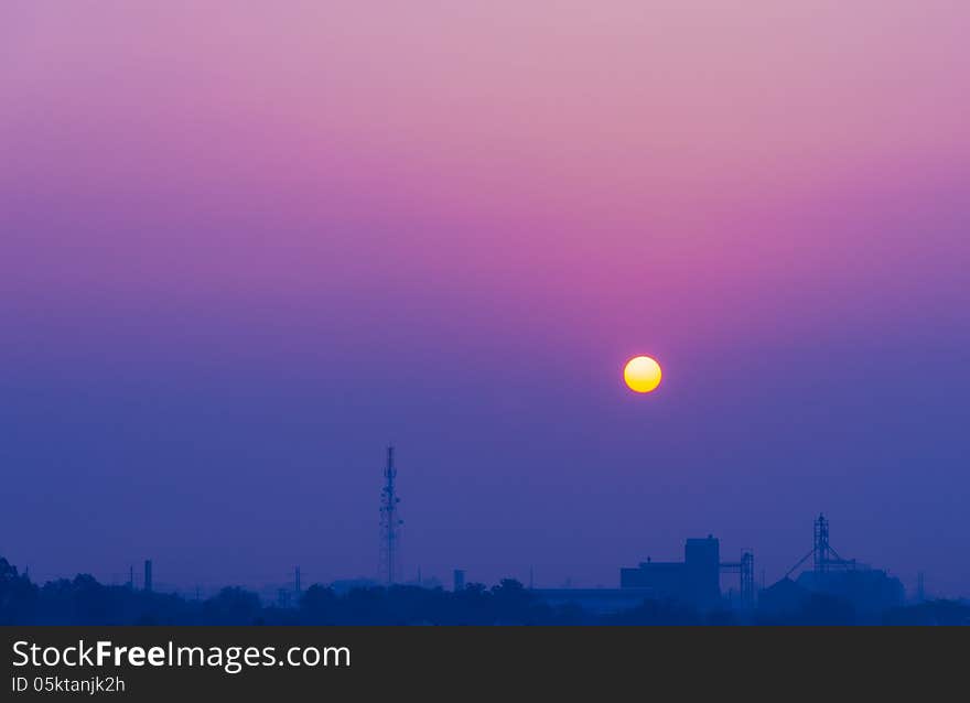 Sunrise sky at industrial scape