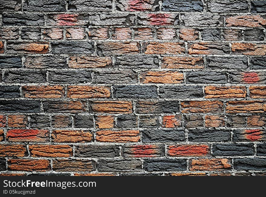 Orange and dark grey fired bricks set in thick grey mortar. House in the Annex, Toronto. Orange and dark grey fired bricks set in thick grey mortar. House in the Annex, Toronto.