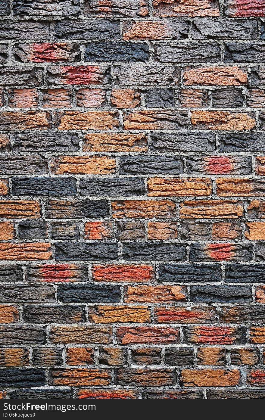 Orange and dark grey fired bricks set in thick grey mortar. House in the Annex, Toronto. Orange and dark grey fired bricks set in thick grey mortar. House in the Annex, Toronto.