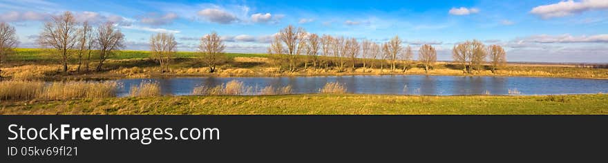 Autumn landscape of river and trees and bushes. Autumn landscape of river and trees and bushes