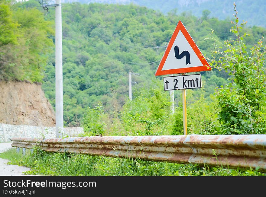 Traffic Curve road sign on a rural area