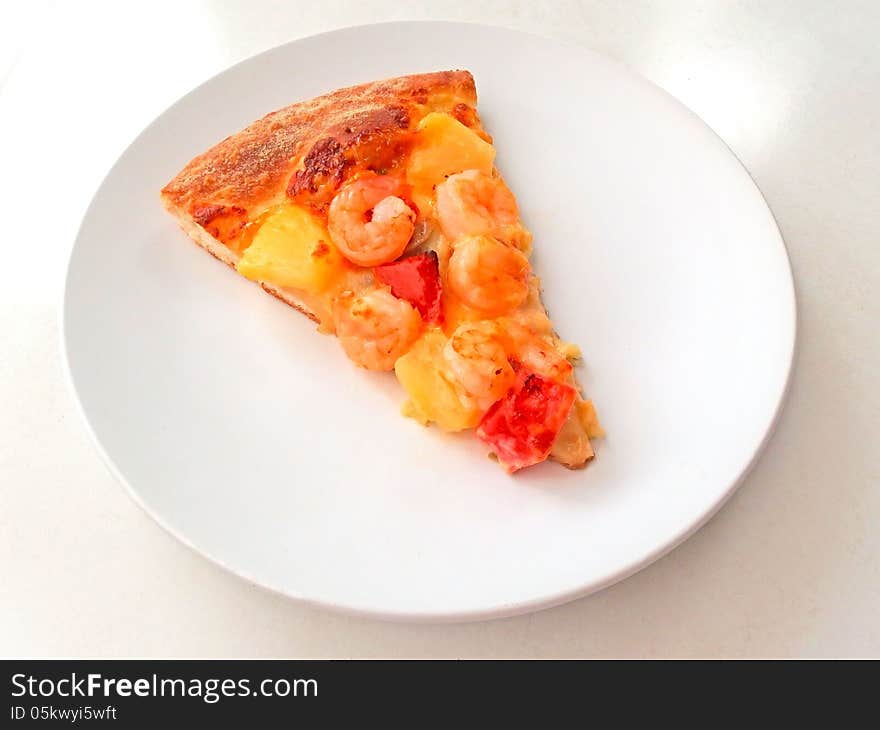 Cut off slice pizza on white dish