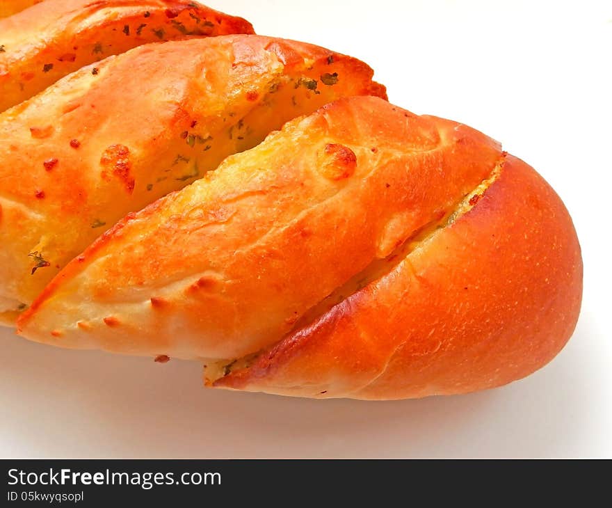 Close up of garlic bread on white dish