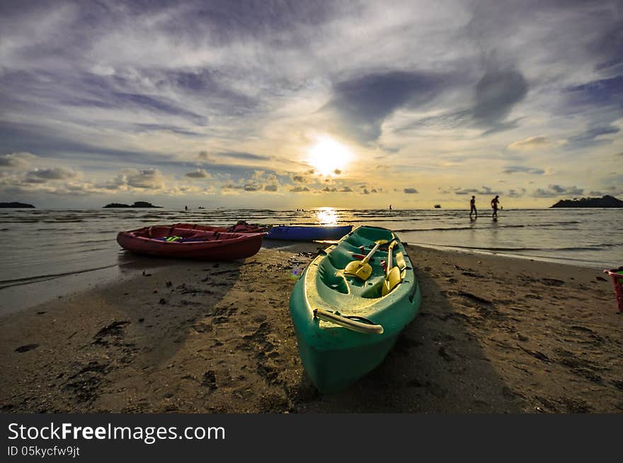 Kayaks sunset on koh chang beach Thailand