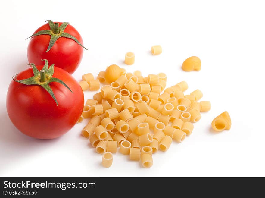 Raw pasta with cherry tomatoes with white space for your text here