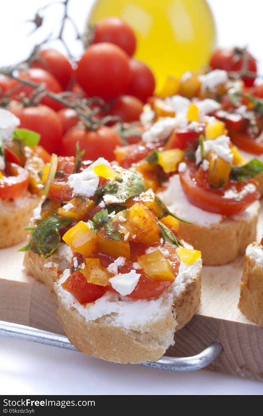 Appetizer called Bruschetta with cheese and vegetables