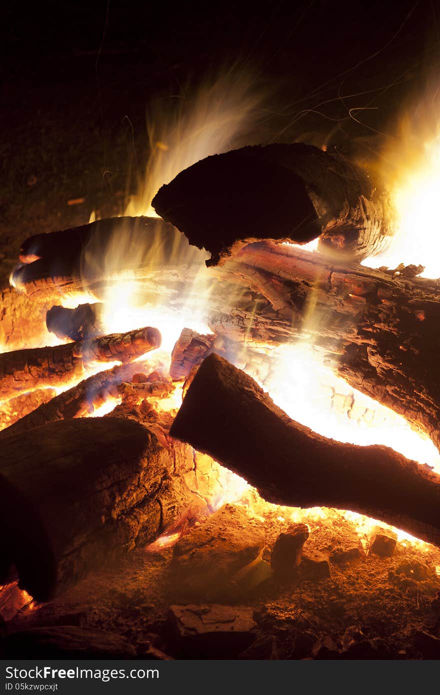 Burning camping fire and wood