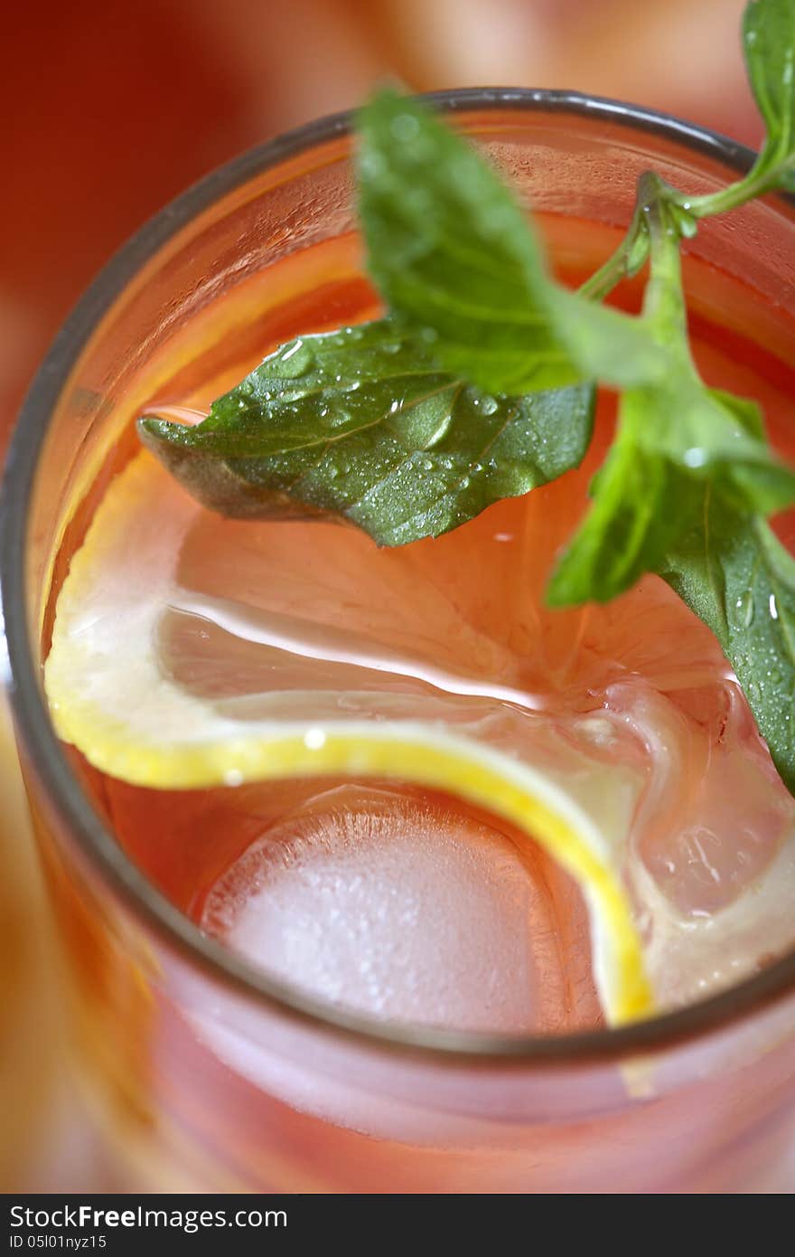 Fresh ice tea with sliced lemon and mint