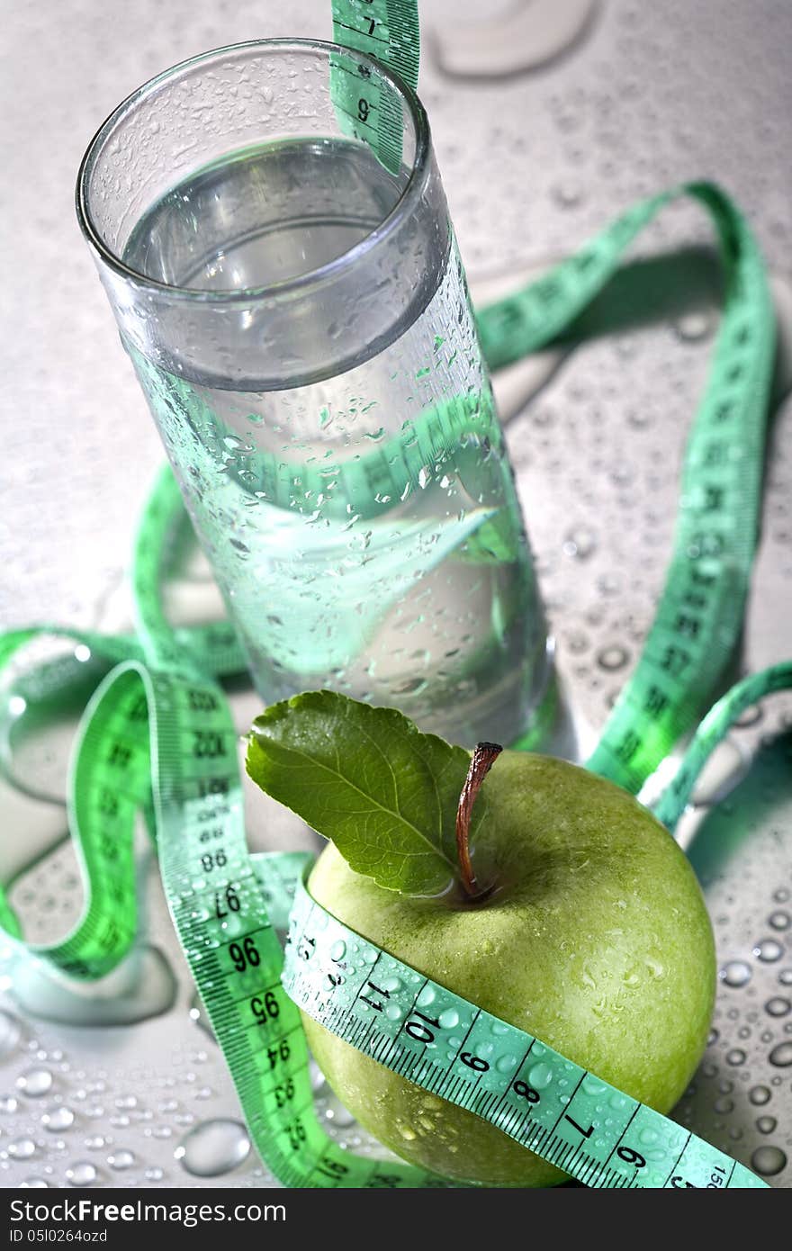 Healthy concept - apple glass of water and tape. Healthy concept - apple glass of water and tape