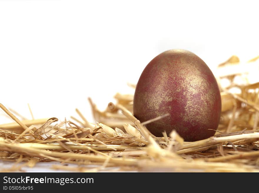 Close-up portrait of red and golden egg. Close-up portrait of red and golden egg