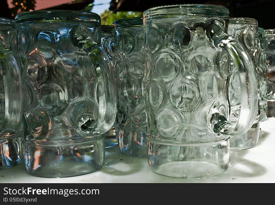 Great Bavarian beer glasses in the beer garden. Great Bavarian beer glasses in the beer garden