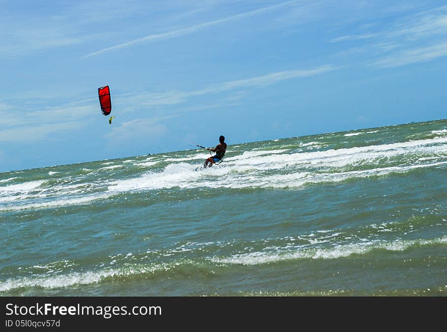 The man play kitesurf