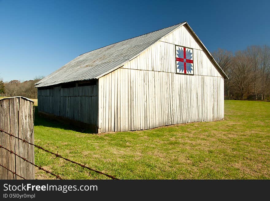 An old barn with a classic quilt block.