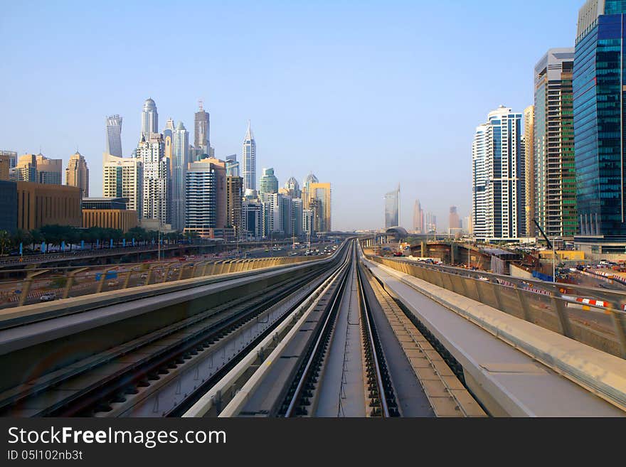 Dubai metro mainly ground. The picture was taken from the last wagon, where the panoramic view of the city. Dubai metro mainly ground. The picture was taken from the last wagon, where the panoramic view of the city.