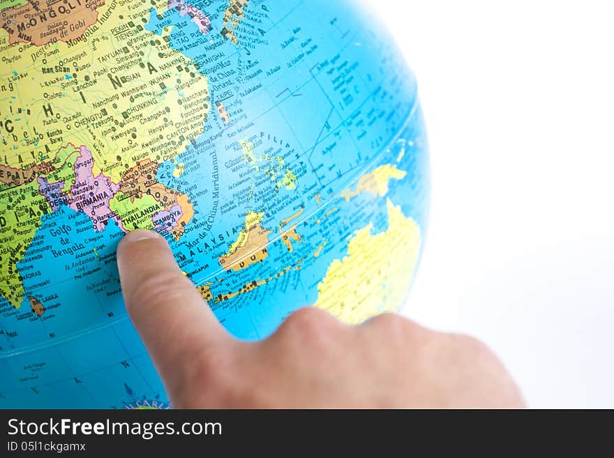 Thailand index finger pointing in a world globe on white background. Thailand index finger pointing in a world globe on white background