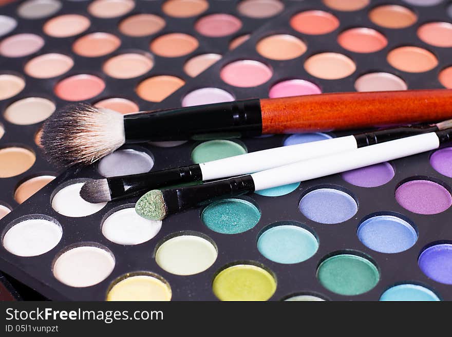 Colorful set of professional eye shades wit brushes