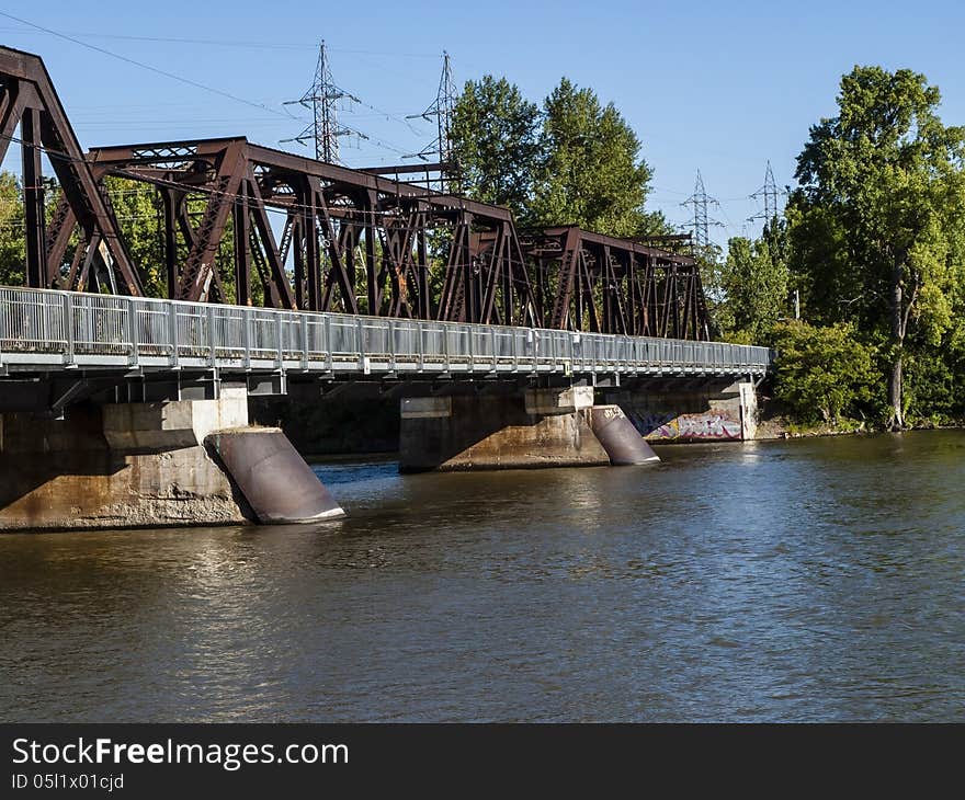 Metal steel bridge on a clear blue sky