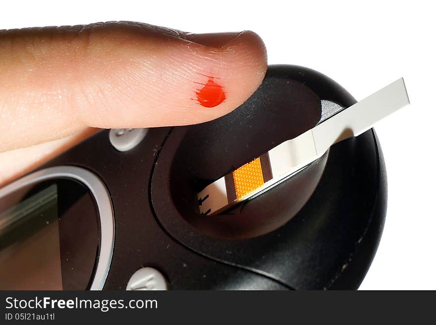 Blood Sample Applied On Photometric Glucose Meter