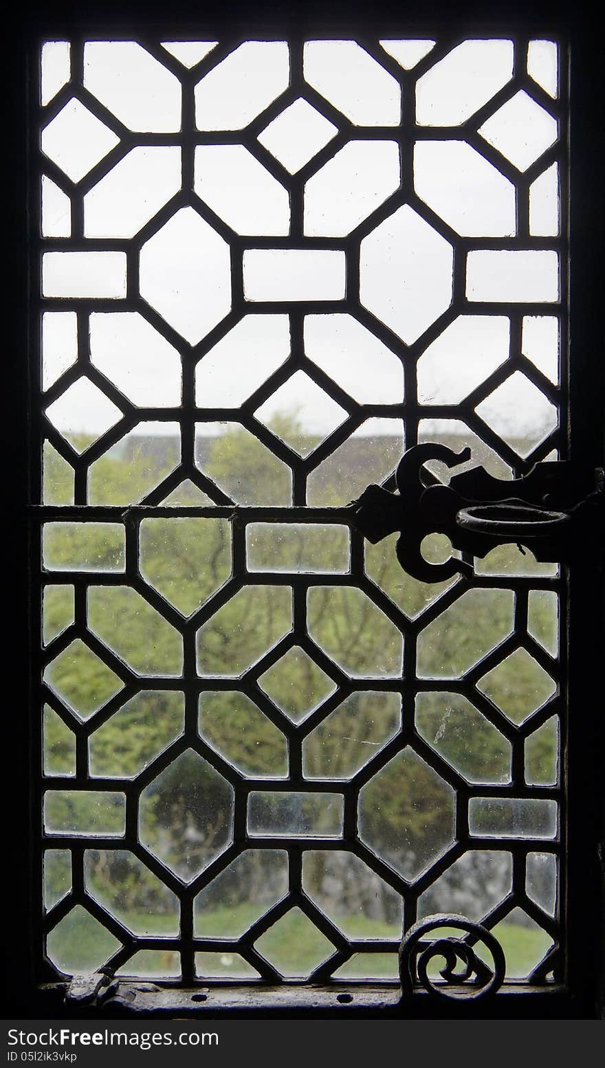 View through a very old window. View through a very old window