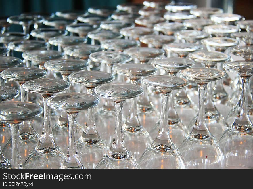 Rows of Empty Wine Glasses on the table ready for guests