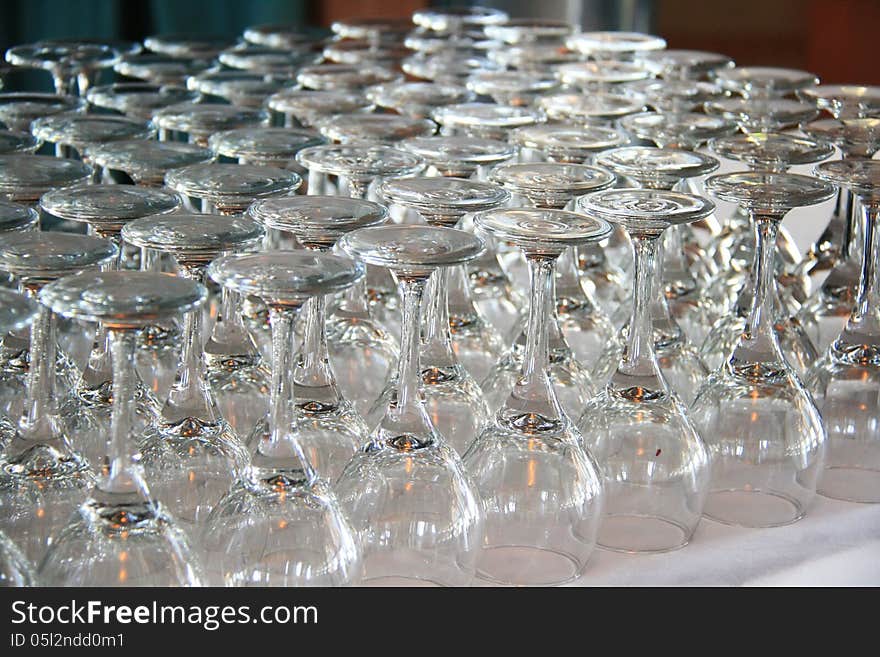 Rows of Empty Wine Glasses on the table ready for guests