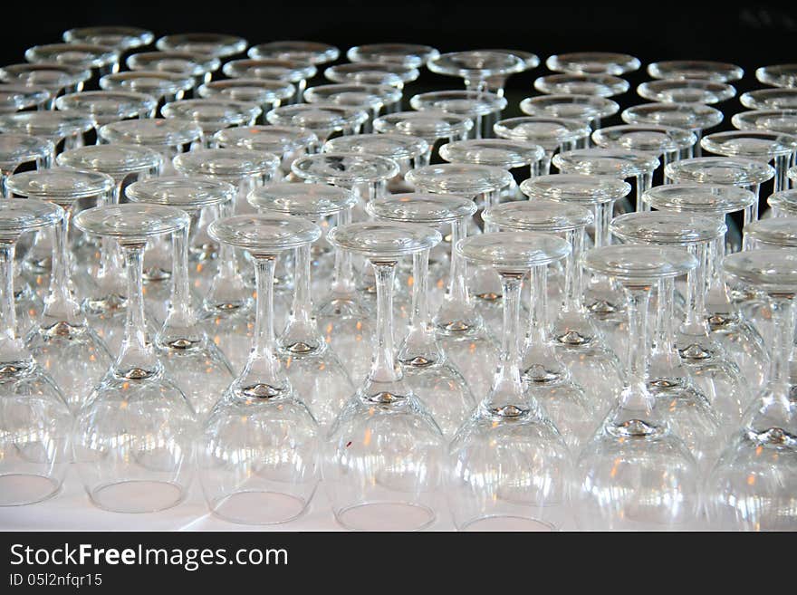 Rows of Empty Wine Glasses on the table ready for guests