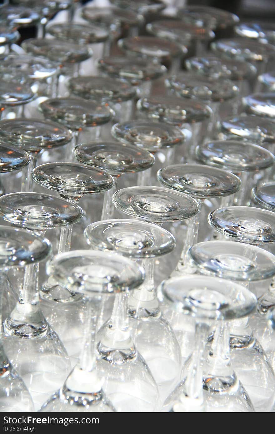 Rows of Empty Wine Glasses on the table ready for guests