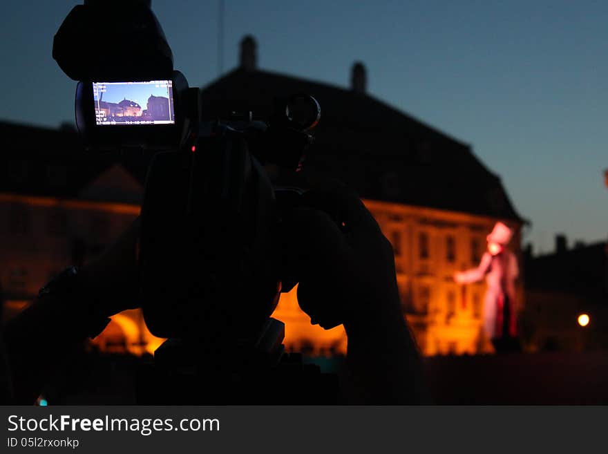 Video camera viewfinder - recording located outdoor in the night on a street. Video camera viewfinder - recording located outdoor in the night on a street.