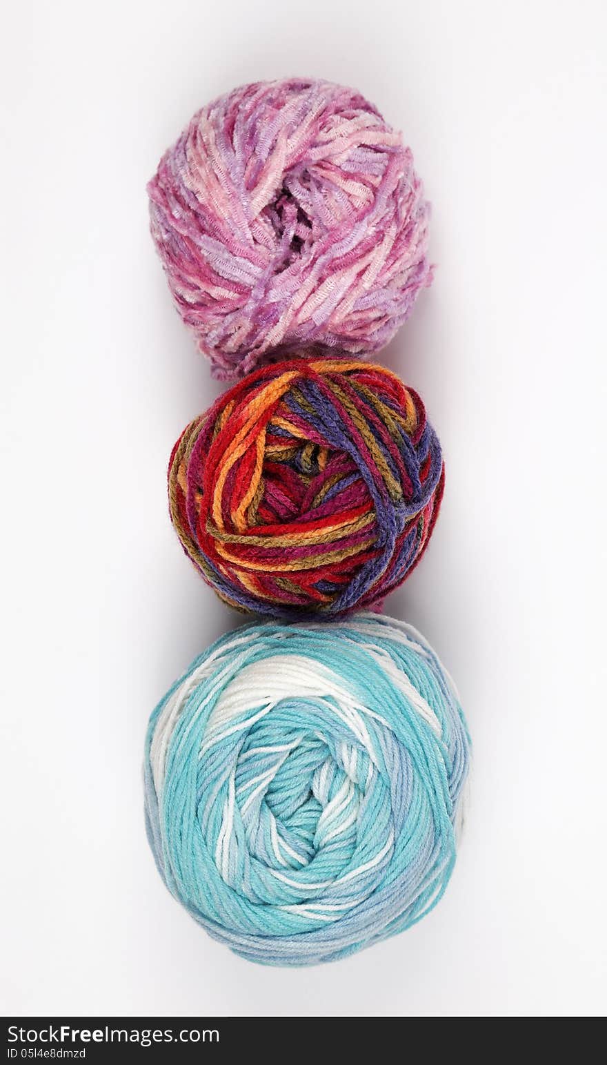 Colorful balls of yarn on white background. Colorful balls of yarn on white background