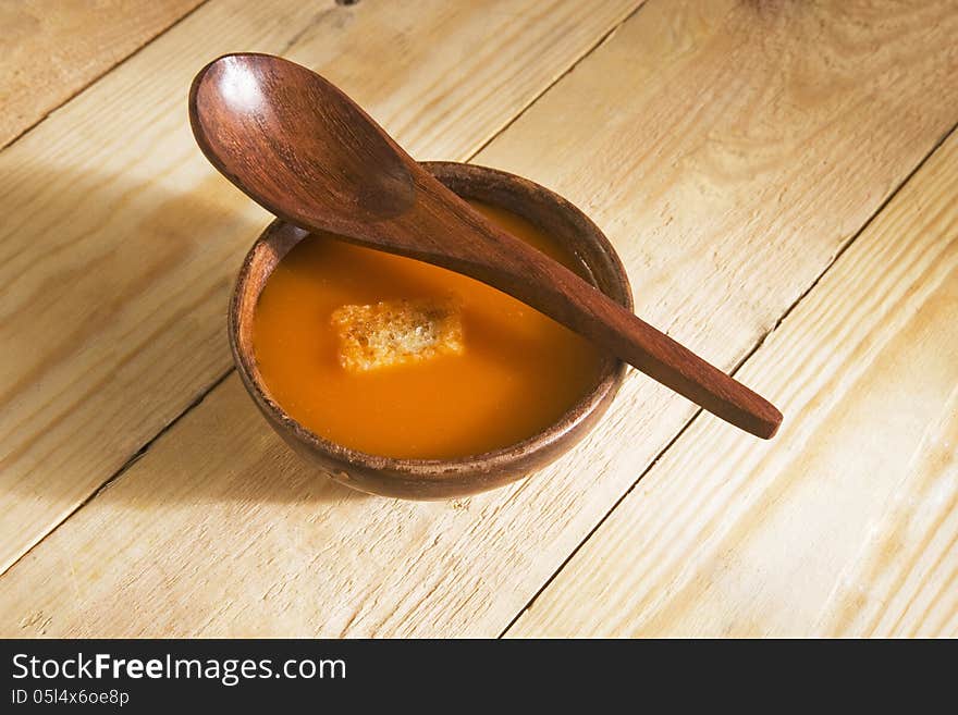 Vegetable Tomato Soup in wooden bowl